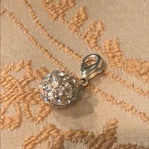 Necklace charm. Unsure of brand.
